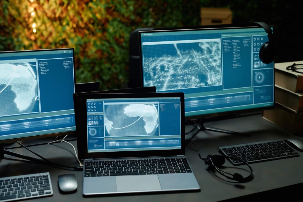 two computer monitors and laptop with information 2025 03 07 15 17 57 utc